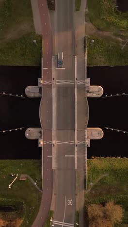 symmetrical bridge over canal - aerial perspective