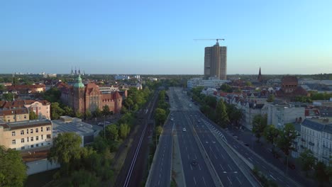 Gorgeous-aerial-top-view-flight-Freeway,-Historic-school-building-Berlin-city-Germany-in-Europe,-summer-day-2023