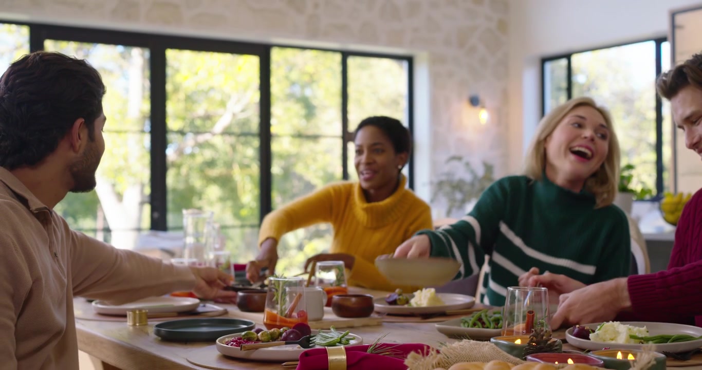 Friends Sharing a Meal at a Festive Dinner Party