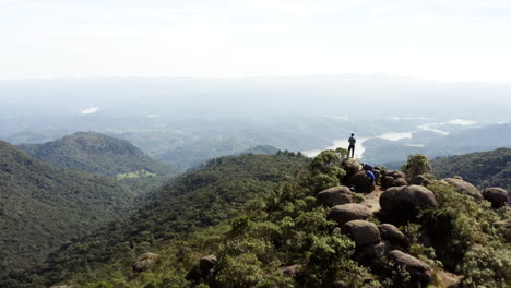 Epic-shot-of-a-hiker-on-the-summit-of-a-brazilian-amazon-rainforest-tropical-mountain,-Brazil,-South-America