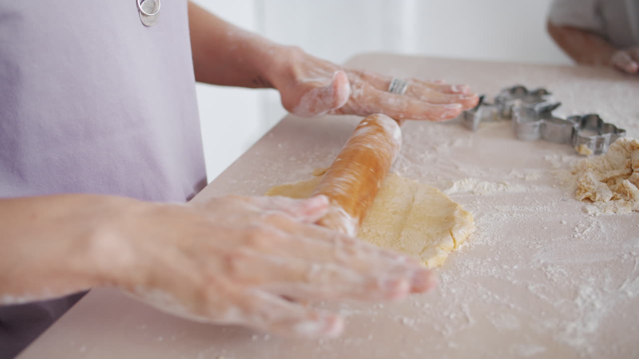 Woman rolling out cookie dough