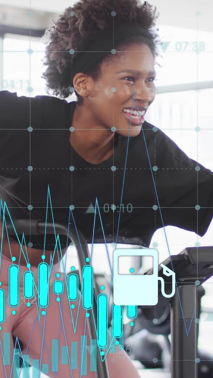 Vertical video: Woman upping cadence airbike, HUD charts appearing and densifying, tracking fitness