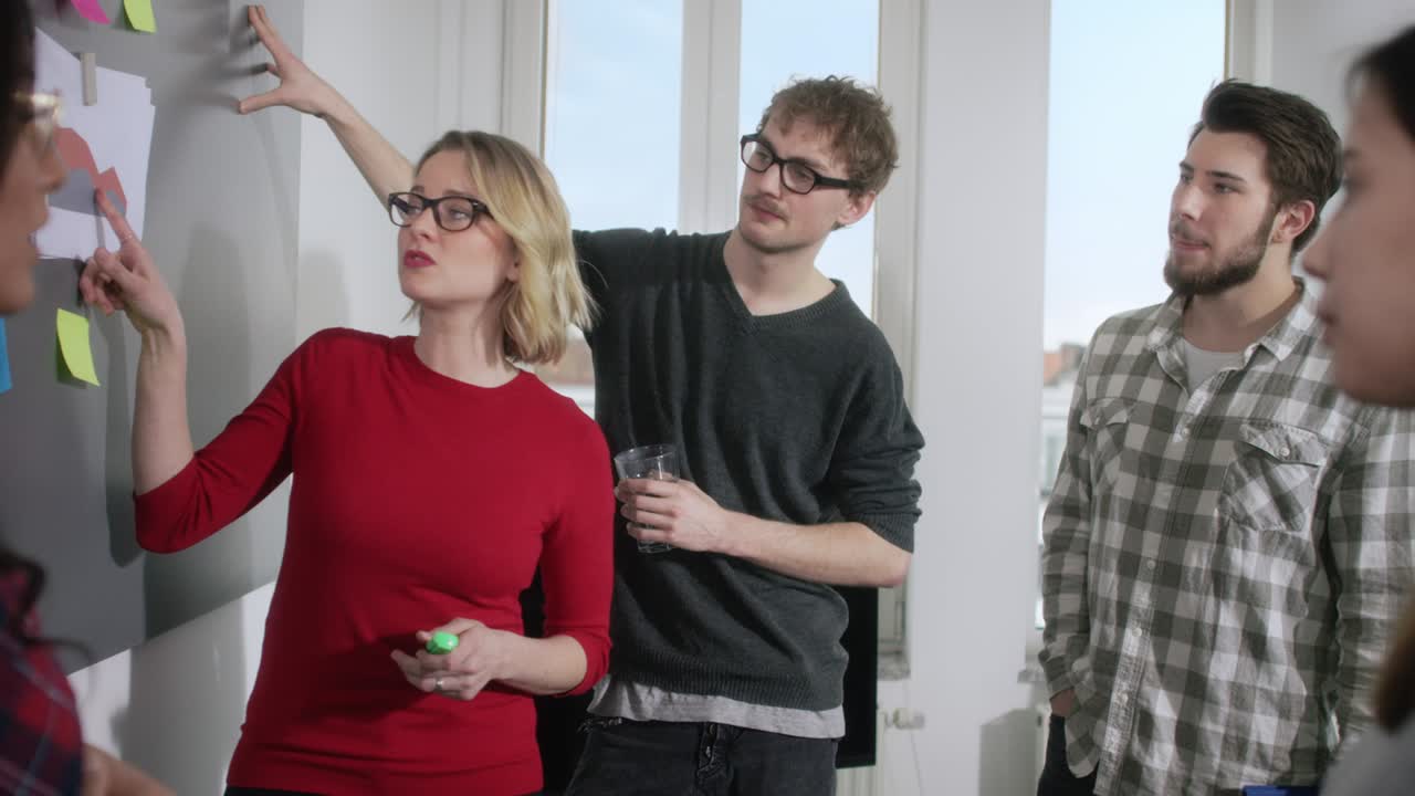 Young focused business people in a new office brainstorming about the company analysis which leads to a critical discussion