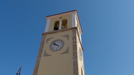Saint-charalambos-church,-an-old-historic-yellow-and-brown-building-with-a-white-clock-in-Preveza,-Greece