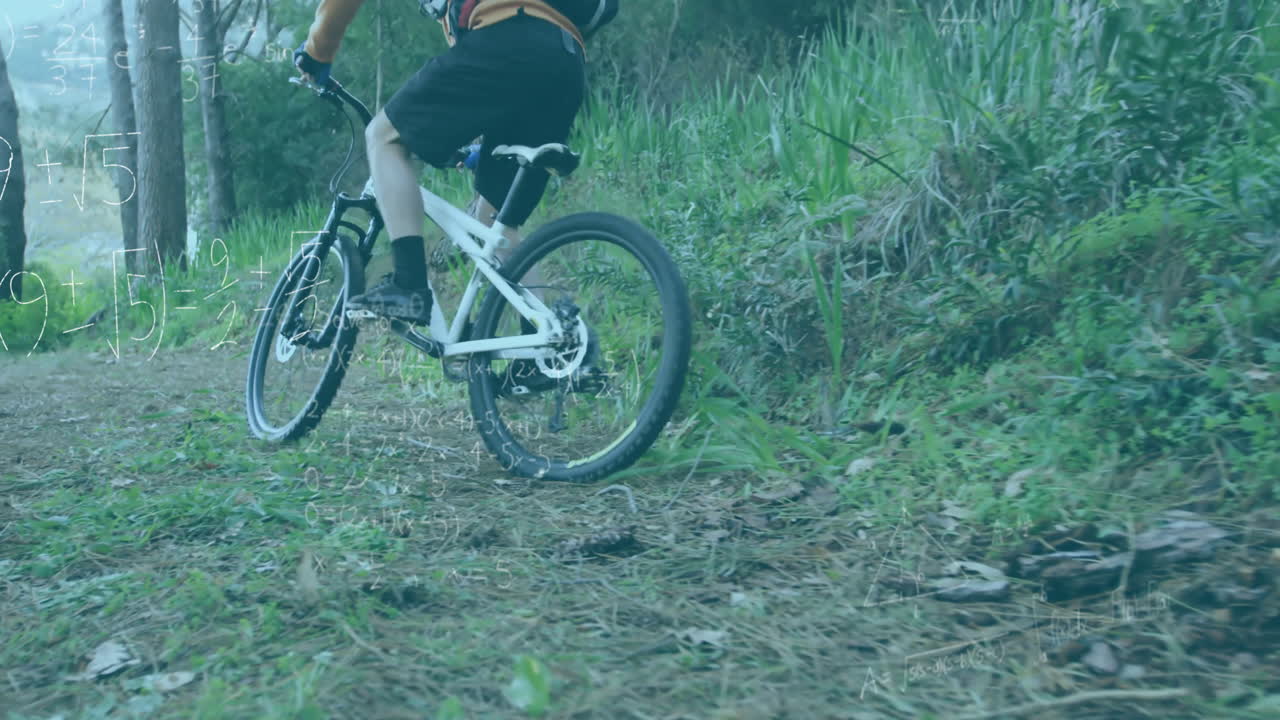 Cyclist navigating forest trail, showing algebraic equations overlay for education technology