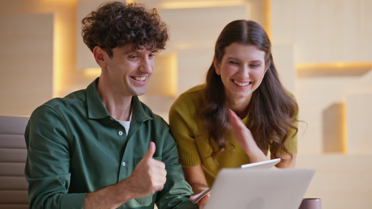 Couple working on a laptop and tablet