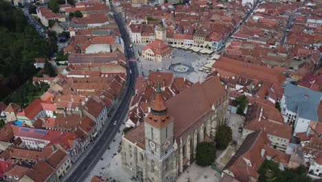 backward drone of black church reveal brasov cityscape in romania