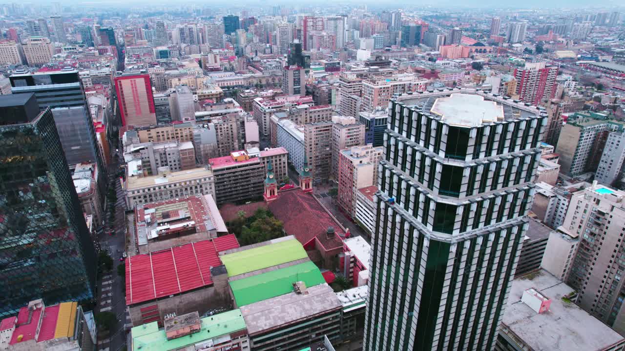 Bird's eye view establishing the Centennial Tower and La Merced Church overlooking the historic center of Santiago, Chile