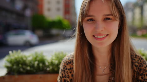 young woman smiling outdoors