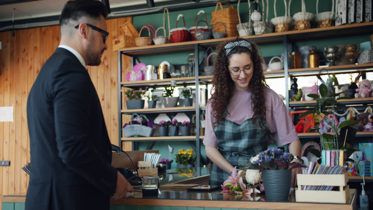 Customer purchasing flowers in a florist shop