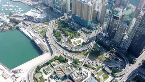 Traffic-heading-in-and-out-of-Cross-Harbour-Tunnel,-Causeway-Bay,-Downtown-Hong-Kong,-Aerial-view