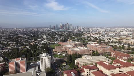 downtown los angeles, over usc campus, rising aerial view on cloudy afternoon