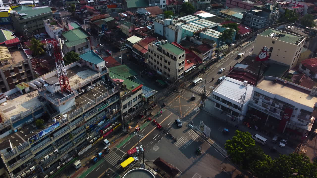 Drone tracking traffic on the street of Metro Manila, sunny day in Philippines