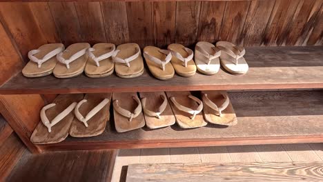 pairs of geta on the wooden rack in japan