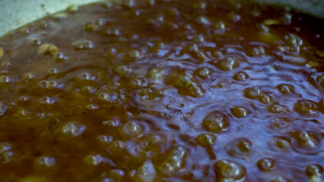 bubbling curry sauce in pot