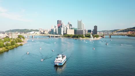 an aerial over a paddlewheel tourist boat on the monongahela river over pittsburgh pennsylvania