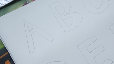 hand-drawn alphabet letters on paper