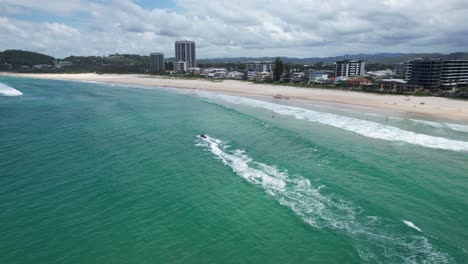 jet ski on a perfect day in palm beach - gold coast - queensland qld - australia - drone shot