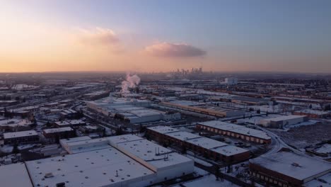 industrial winter view with downtown skyscrapers in the background