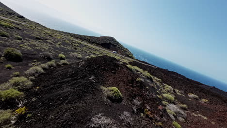 fpv drone over rugged montaña de lajio terrain, sense of freedom