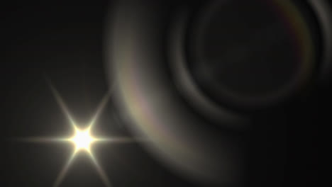 Digital-animation-of-spot-of-light-and-lens-flare-against-black-background