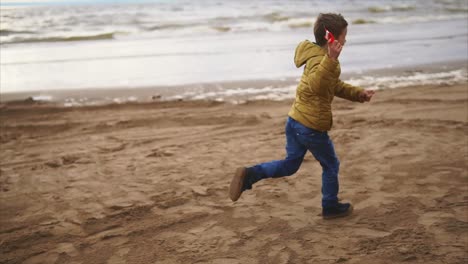 boy playing on the beach