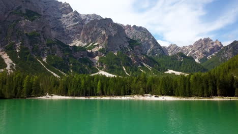 lake braies aka pragser wildsee in south tyrol italy, aerial tilt up reveal shot