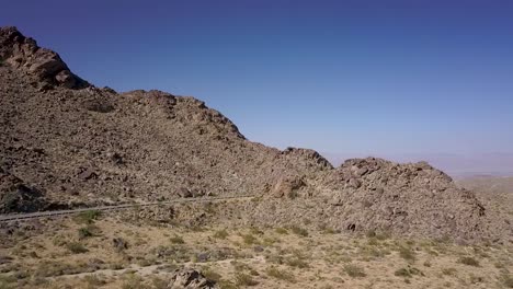 DRONE-PAN-OVER-MOUNTAIN-ROAD-HIGH-DESERT-CALIFORNIA