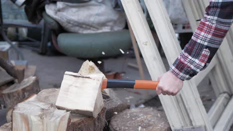 hatchet impacting splitting log in slow motion