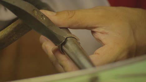 italian goldsmith at work building an engagement or a wedding ring