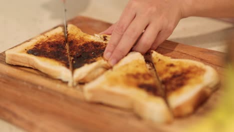 cutting toasted butter bread