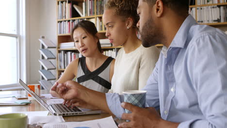 Business-Team-Having-Meeting-In-Busy-Office-Shot-On-R3D