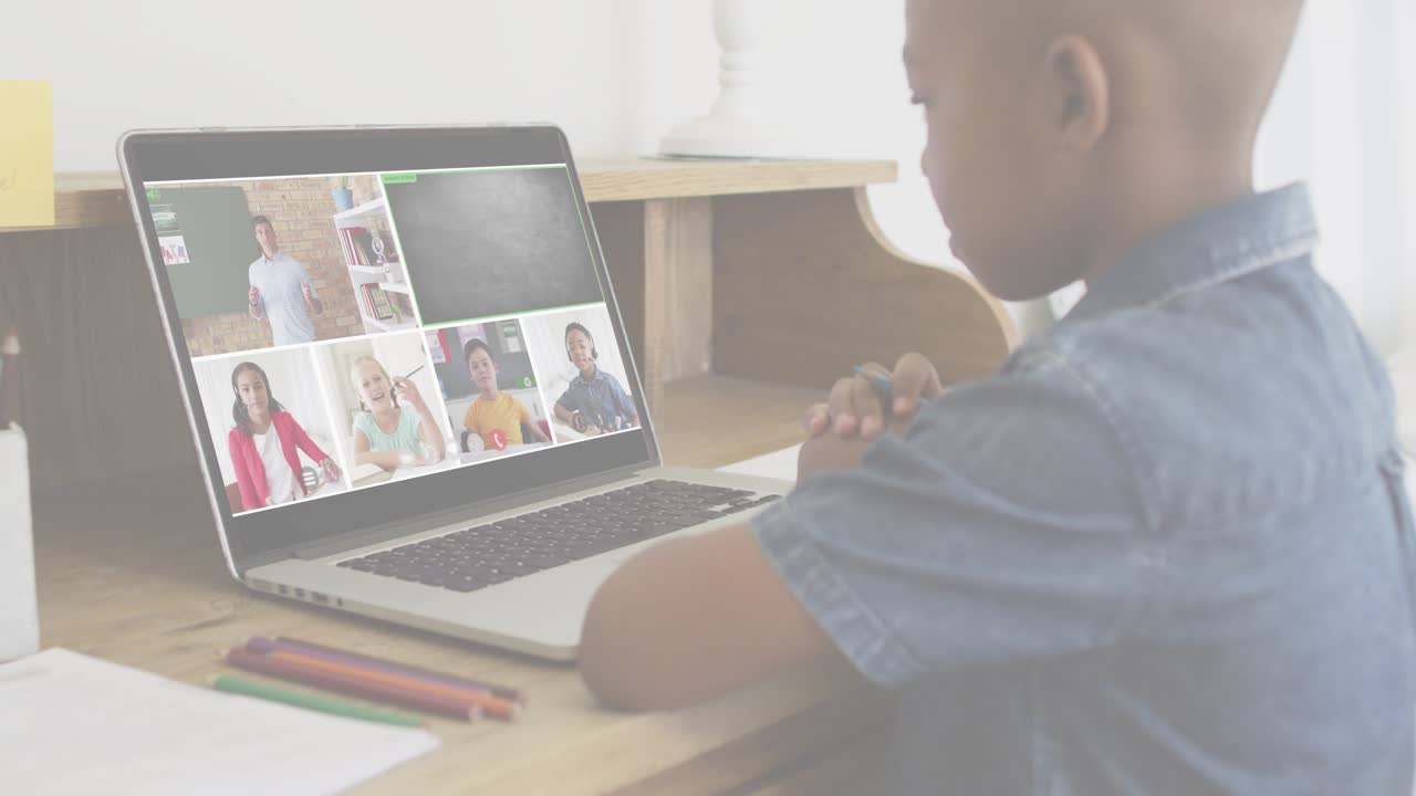 Boy watching laptop to learn in remote class, call causing fingerprint HUD fading over screen