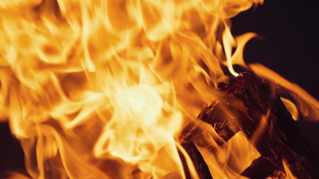 Burning wood in the fireplace and the flames