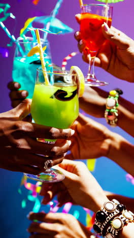 vibrant cocktail toast with confetti