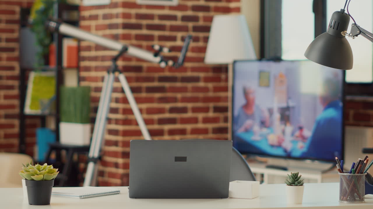 Empty home desk with laptop to work remotely
