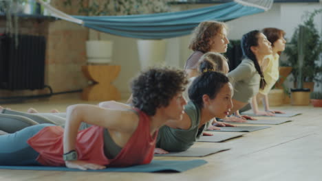 women practicing vinyasa yoga