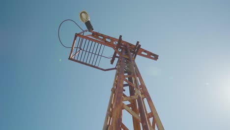 Old-rusty-electricity-pole-on-abandoned-harbor