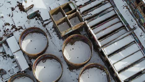 A-drone-shot-directly-overhead,-captures-the-water-and-leaching-tanks-as-well-as-the-roasters-of-the-Old-Tintic-Mill-in-Genola,-Utah,-built-in-the-1920s