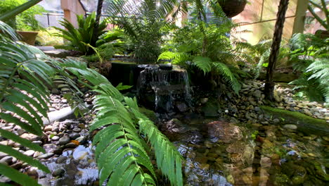 Water-flowing-into-small-pond,-Japanese-Gardens,-Brisbane-Queensland