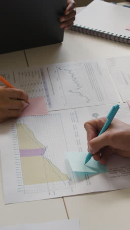 business team analyzing data and project plans