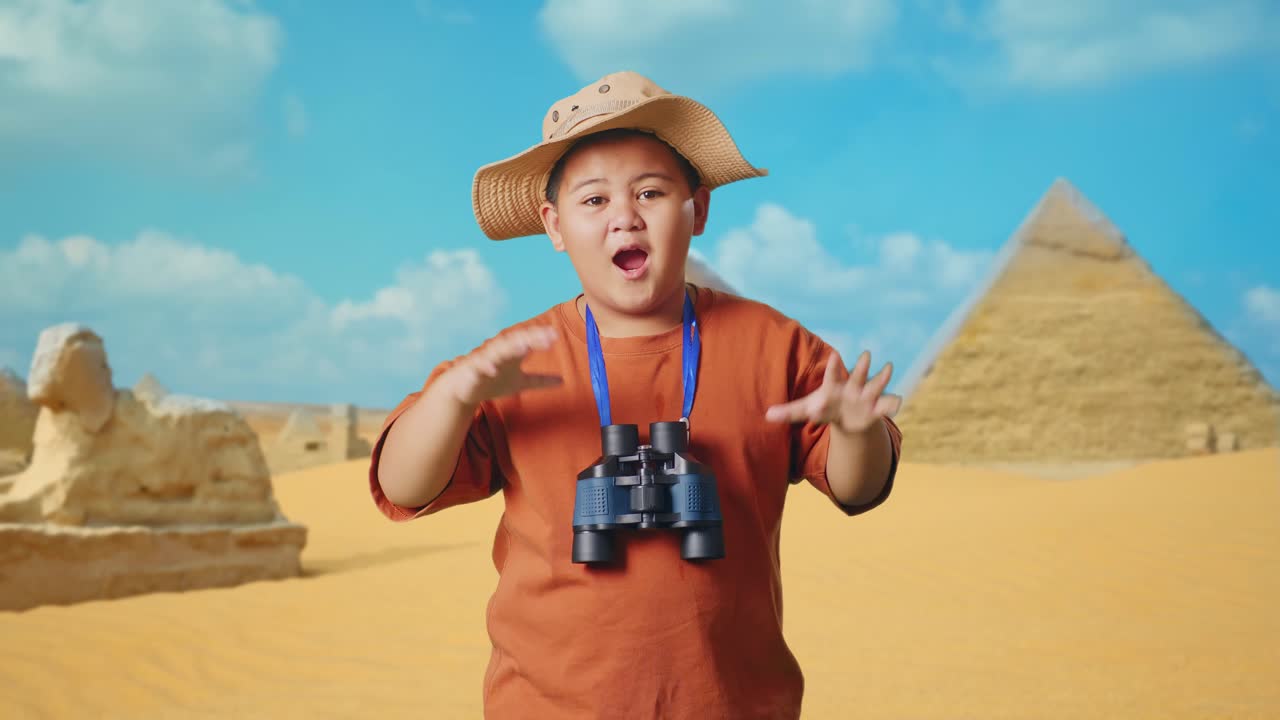 Asian Boy With A Hat Saying Wow After Looking Through The Binoculars. Boy Researcher Examines Something While Traveling In Giza Pyramid, Travel Tourism Adventure Concept