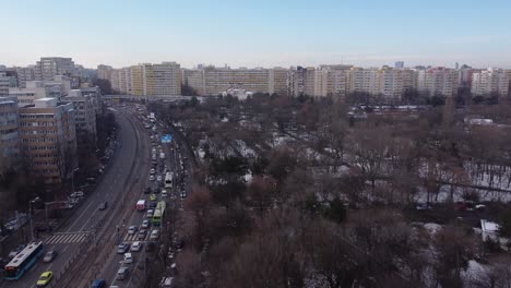 establishing shot at rush hour traffic in the city at winter on day time