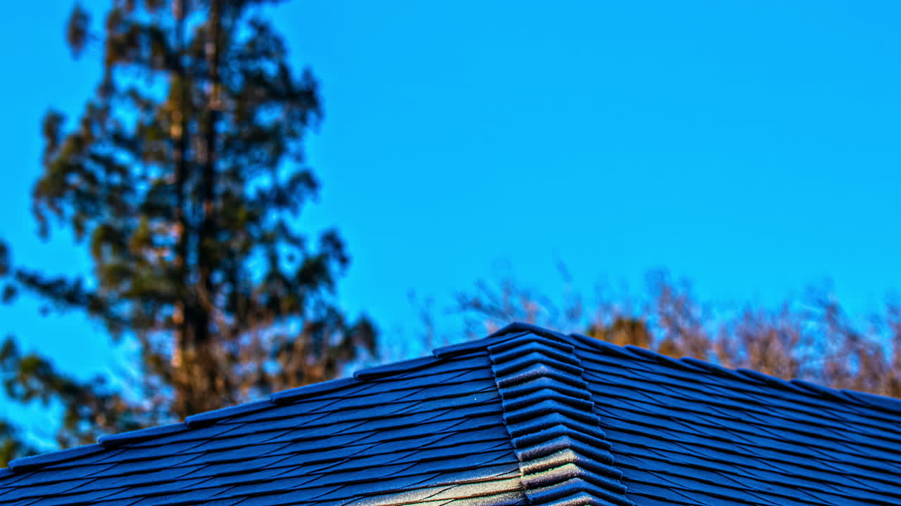 Timelapse of Roof Tiles Defrosting in Morning Sunlight on Cold Winter Morning