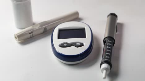 diabetes testing supplies: blood glucose meter and insulin pen