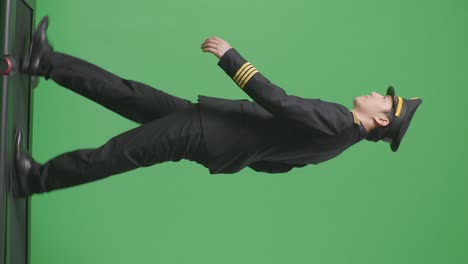 pilot in uniform on a green screen