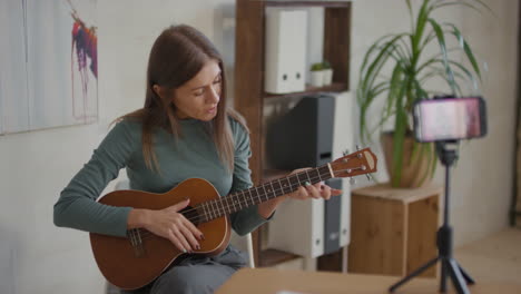 woman playing ukulele