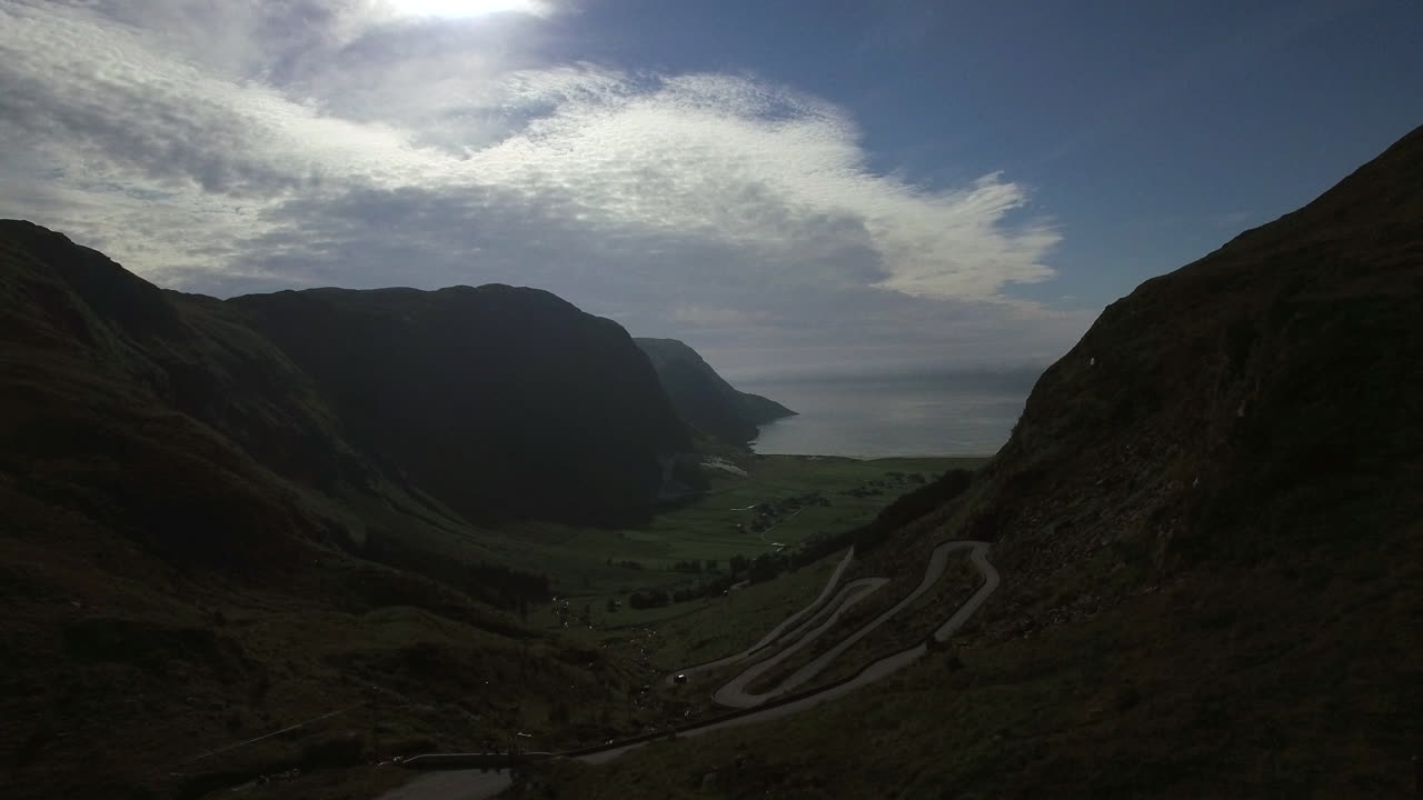 Beautiful road to Hoddevika. Droneshot with Hoddevik beach between high mountains. Hoddevika is in the most western place in Norway, between high mountains. One of the most beautiful places to surf.