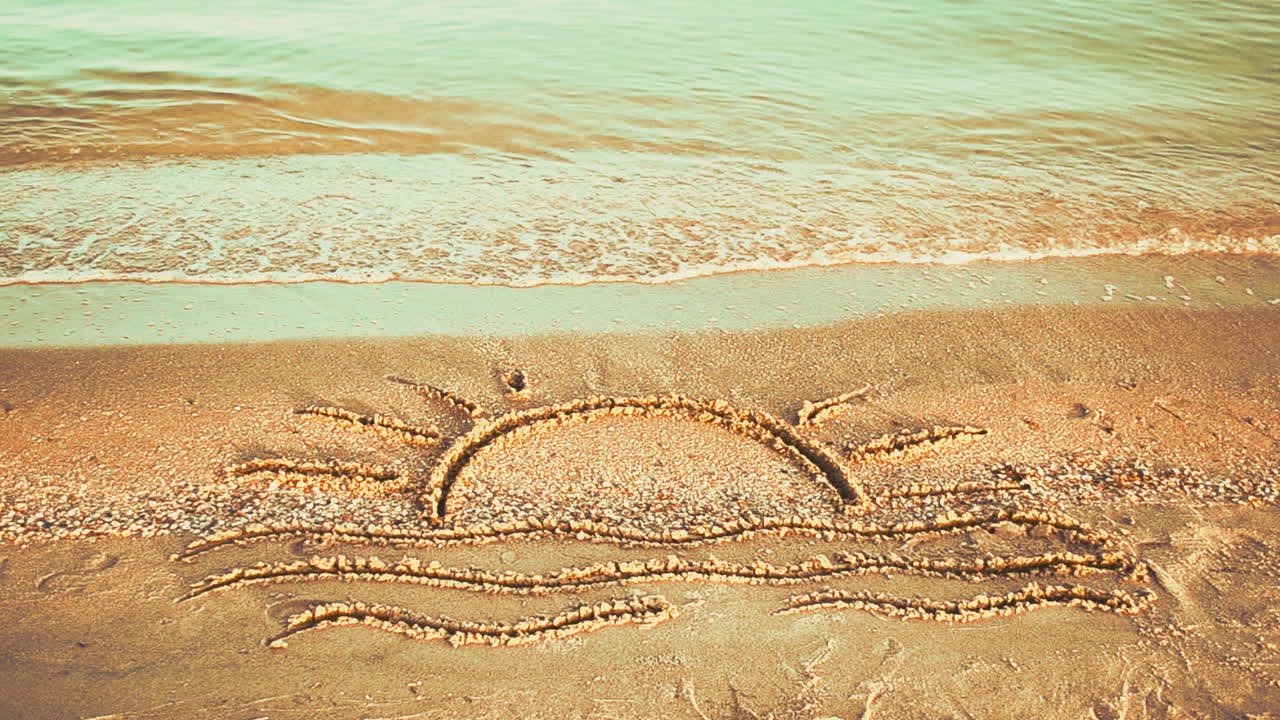 Sun drawing on the beach. Beach and drawing