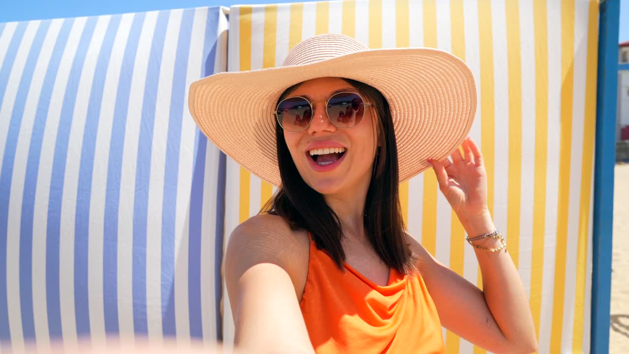 Woman taking selfie on the beach